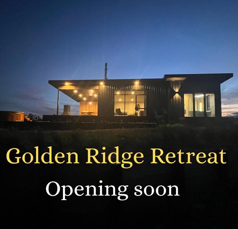 a house with the words golden ridge retreat opening soon at Golden Ridge Retreat in Otorohanga