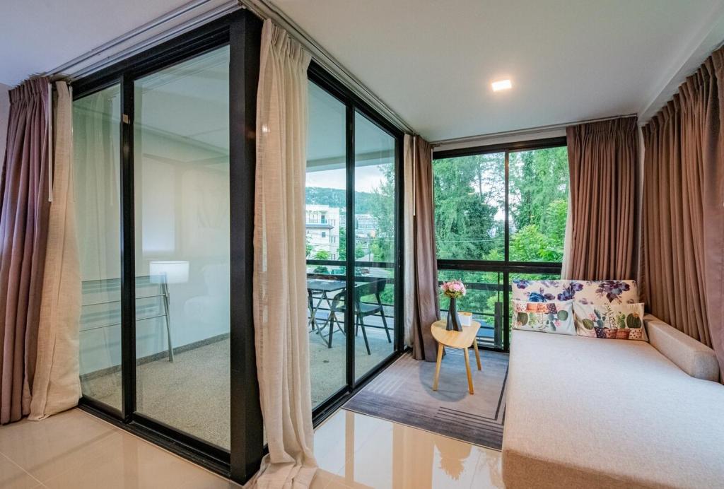 Postel nebo postele na pokoji v ubytování the Kris Bangtao Phuket