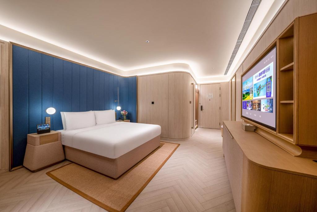 Postel nebo postele na pokoji v ubytování Jingdong Headquarters Crystal Orange Hotel, Yizhuang, Beijing