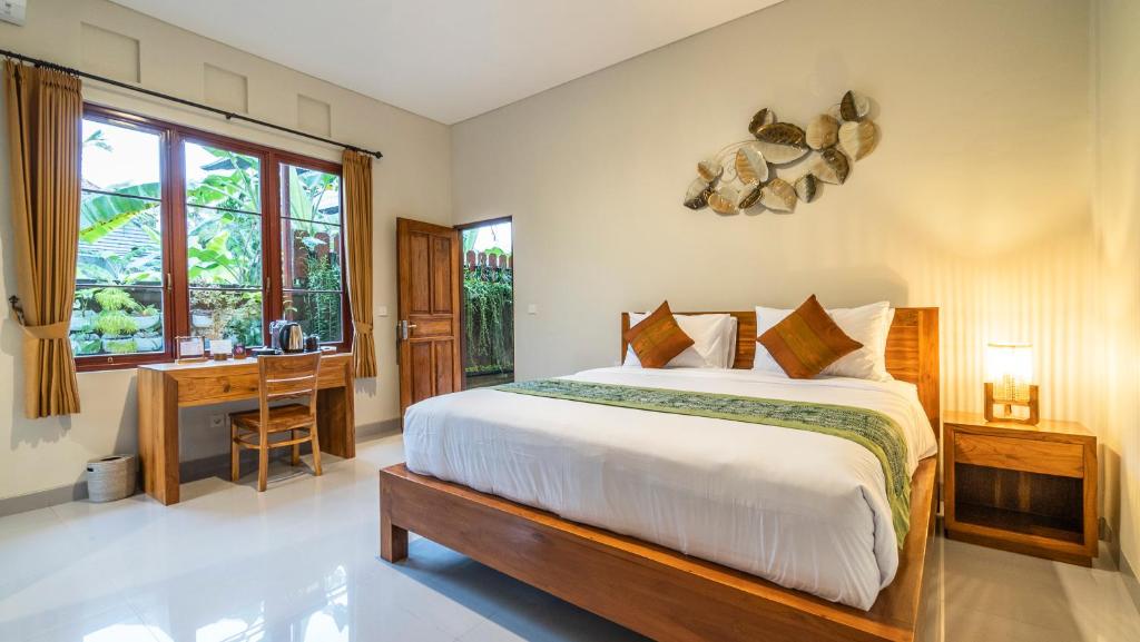 En eller flere senge i et værelse på Khandra Kutuh