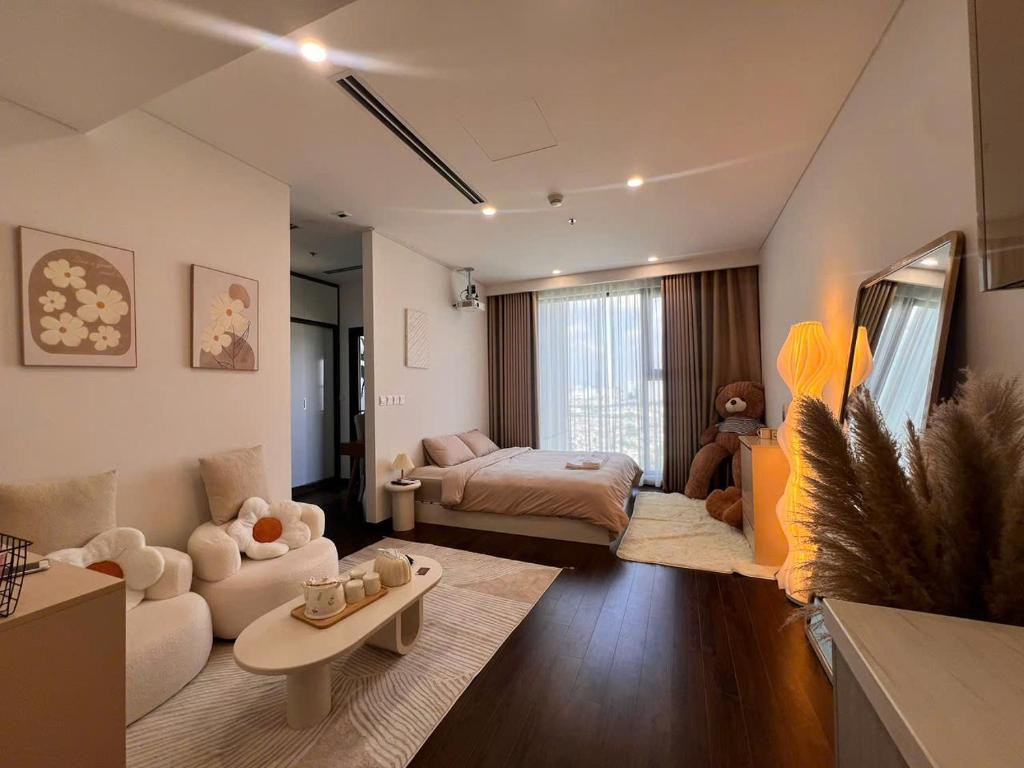 a large living room with a bed and a couch at Gia An Homestay in Phú Thú