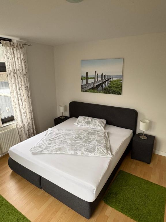 Ένα ή περισσότερα κρεβάτια σε δωμάτιο στο Ferienwohnungen "am Fürstenweg"