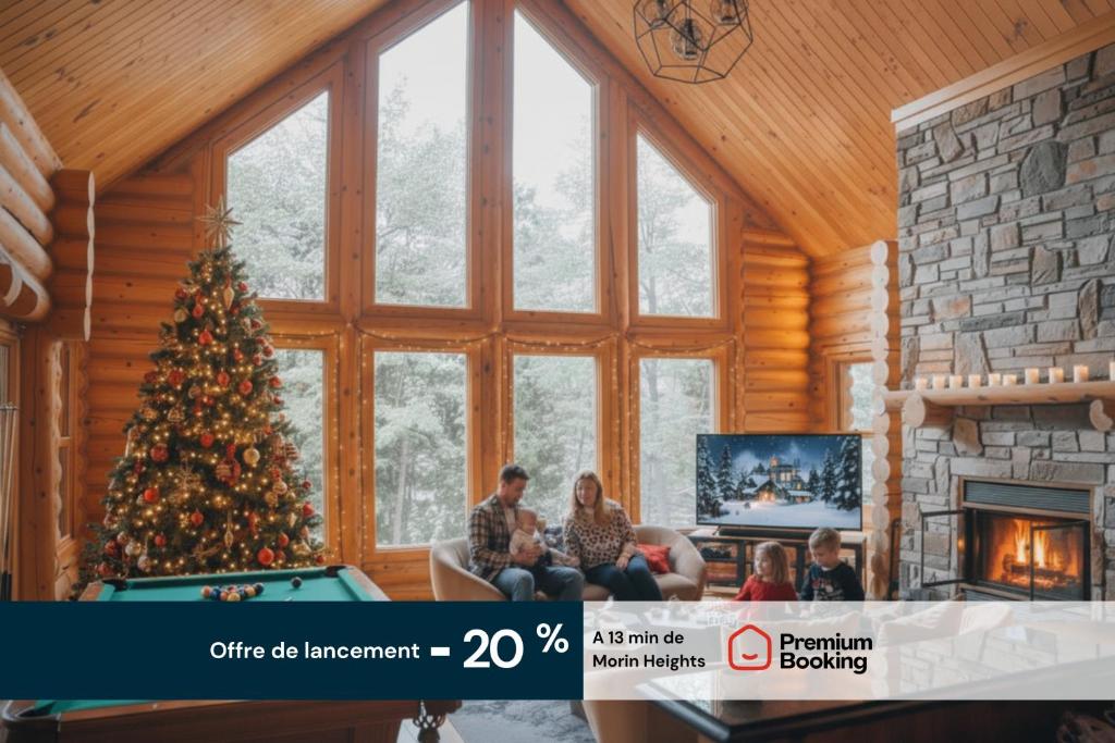 a group of people sitting in a living room with a christmas tree at Bee Private Hot Tub Sauna Ski, Snowshoes in Mille-Isles