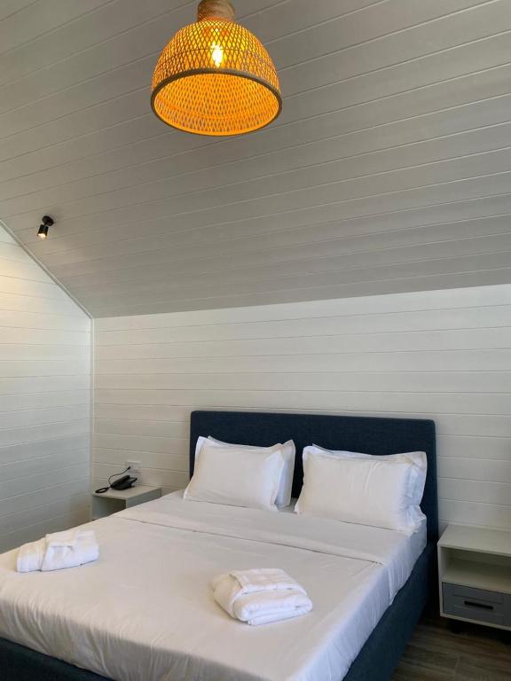 Ένα ή περισσότερα κρεβάτια σε δωμάτιο στο Aykan Resort by Aquasia