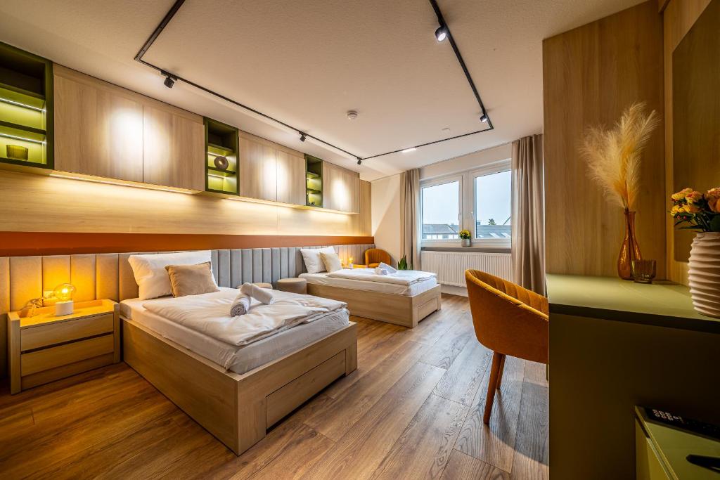 Postel nebo postele na pokoji v ubytování City-House-Achern Studios