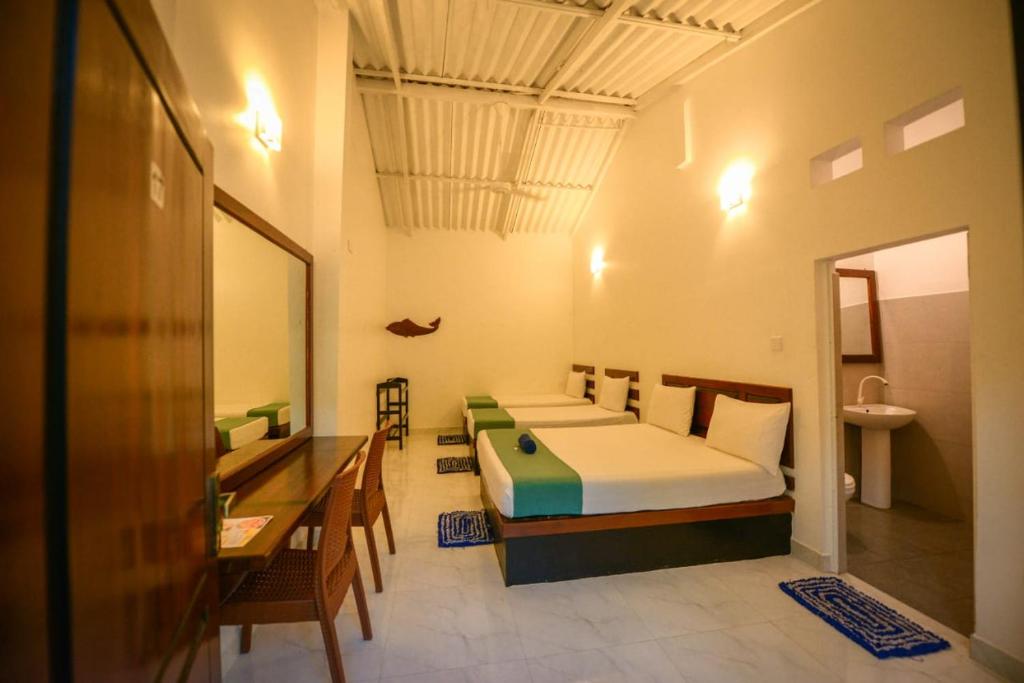 Giường trong phòng chung tại Nugasewana Resort