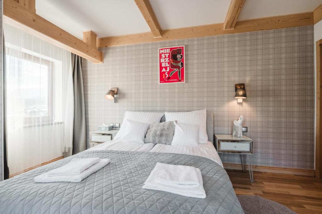 Postel nebo postele na pokoji v ubytování Apartament u Młynarki