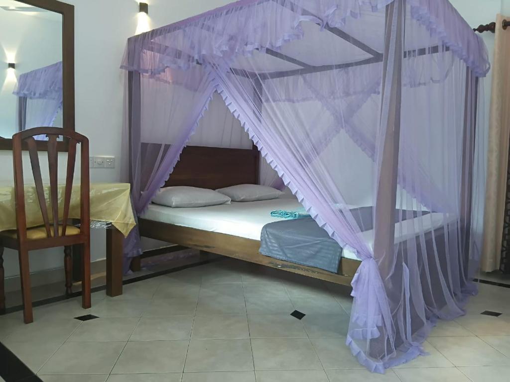 Ένα ή περισσότερα κρεβάτια σε δωμάτιο στο Mirissa Golden Resort