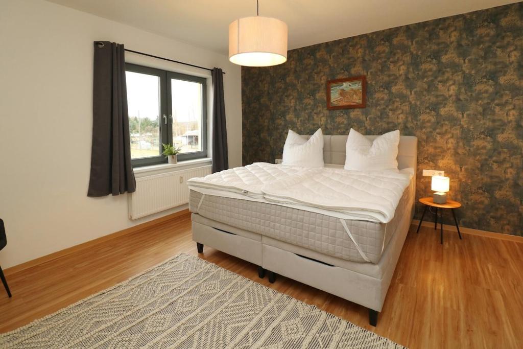 Ένα ή περισσότερα κρεβάτια σε δωμάτιο στο Ferienwohnung 3