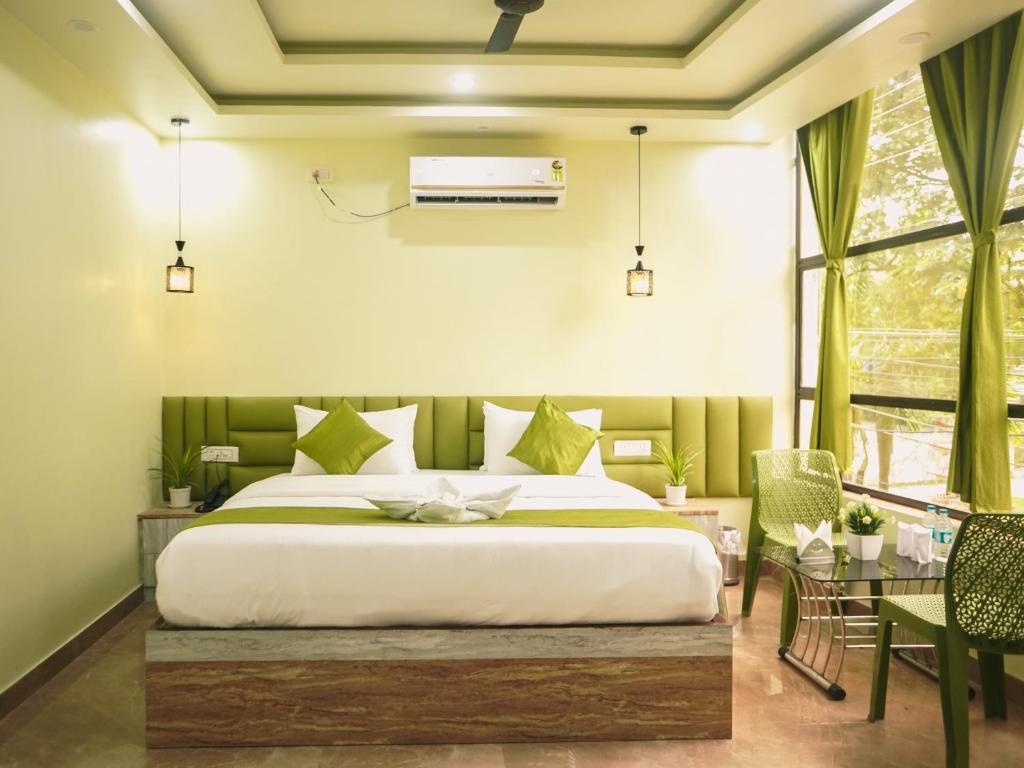 Postel nebo postele na pokoji v ubytování Hotel Raventa