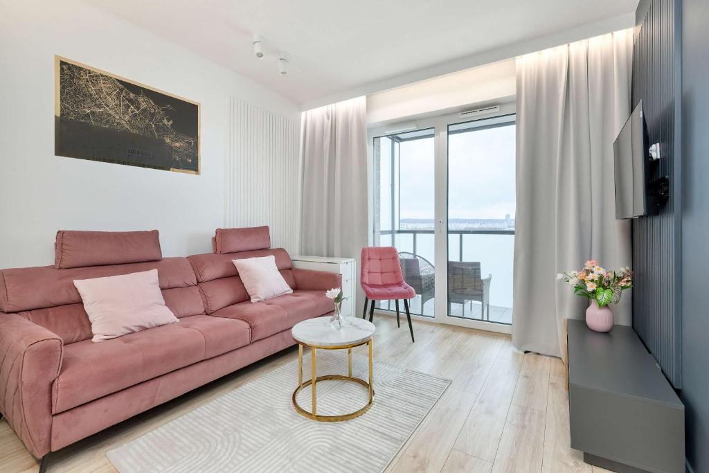 Posezení v ubytování Elegant Apartment with Balcony and Underground Parking by Noclegi Renters