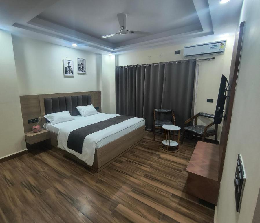 Postel nebo postele na pokoji v ubytování Expo Residency Inn