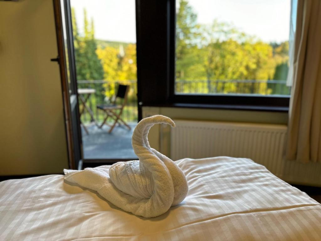 Кровать или кровати в номере Boutique HOTEL am KRANICHSEE