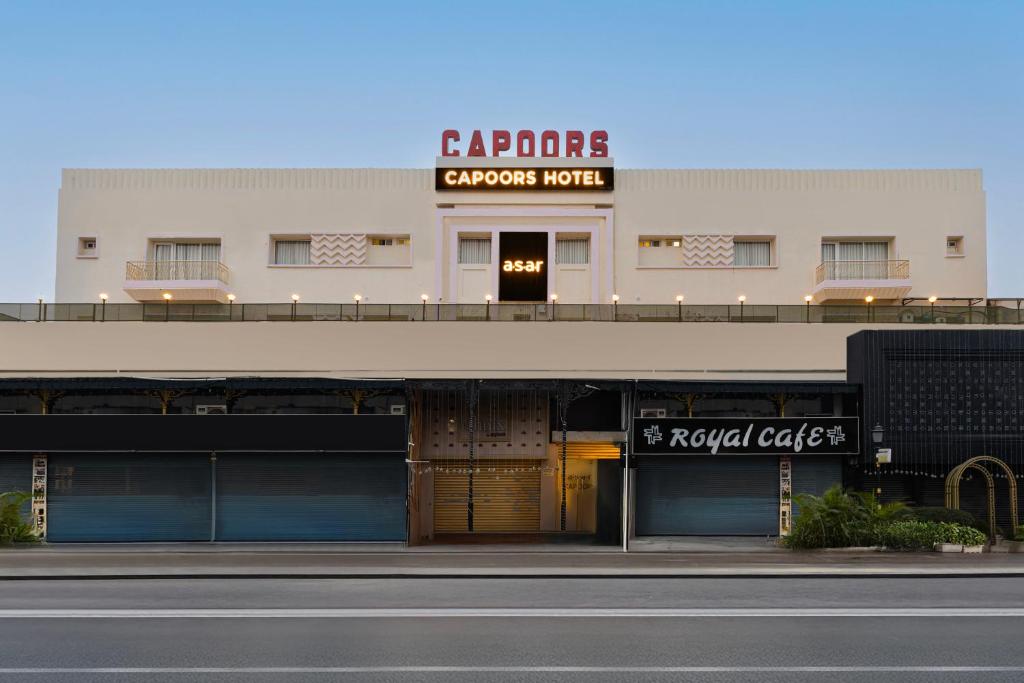 a building with a sign for a car dealership at asar Capoors Hotel by Orion Hotels in Lucknow