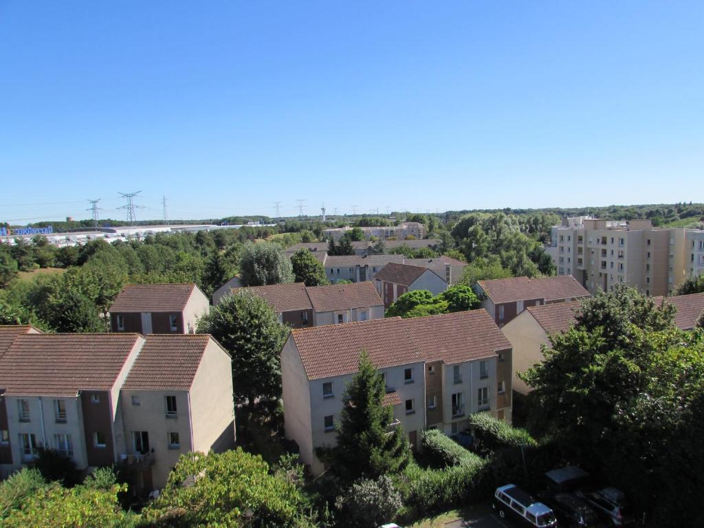 an aerial view of a residential neighbourhood with houses at Kyriad Marne-La-Vallée Torcy in Torcy