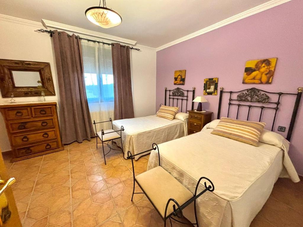 En eller flere senge i et værelse på CASA RuRAL LOS DESAYUNOS