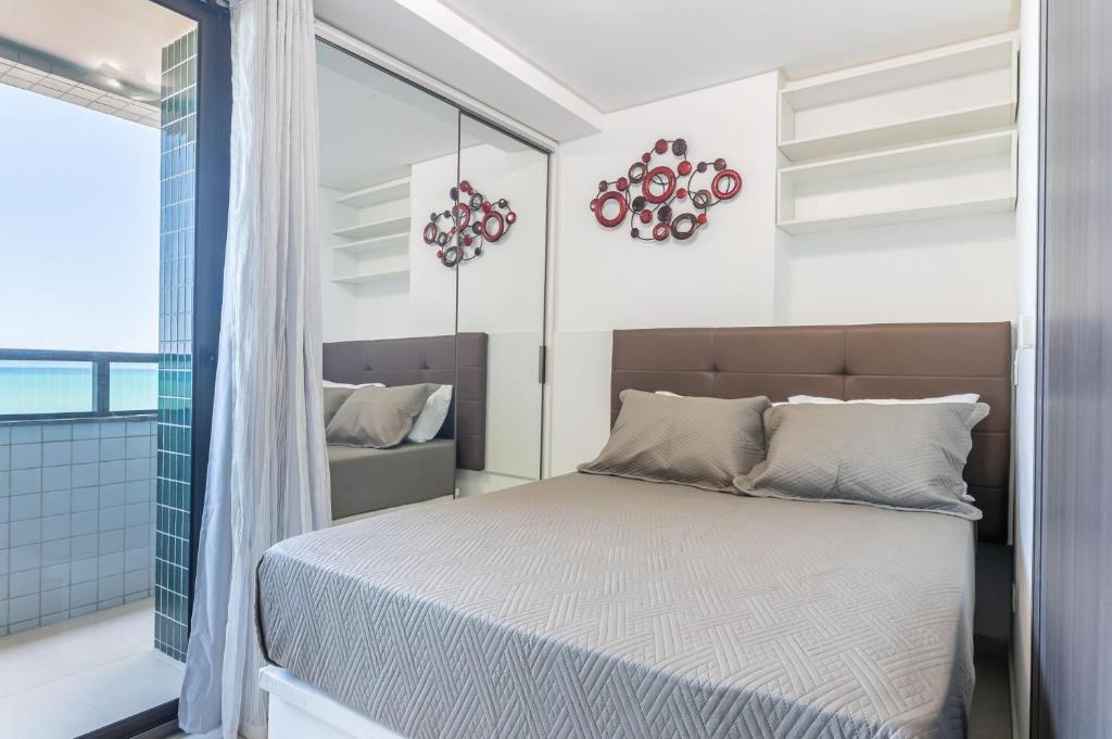 En eller flere senge i et værelse på Studio c/ rooftop com piscina em Olinda - JAM907C