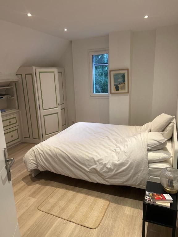 Ένα ή περισσότερα κρεβάτια σε δωμάτιο στο Chambre spacieuse