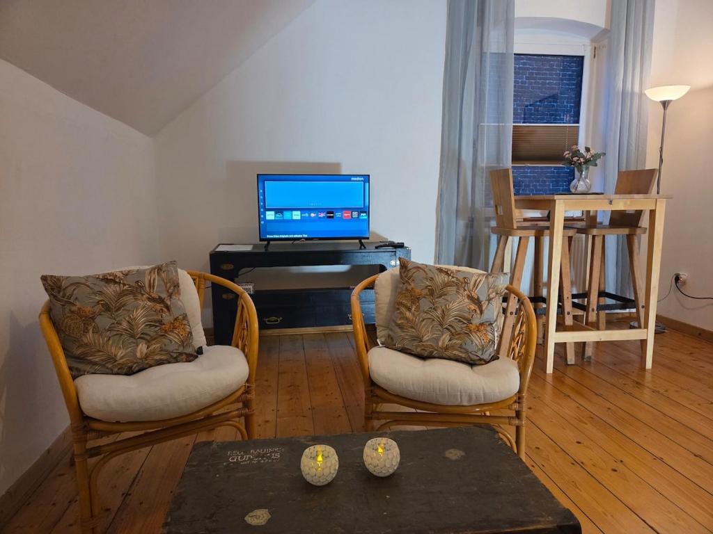 TV a/nebo společenská místnost v ubytování Quartier1905 charmanter Altbau zentral & waldnah