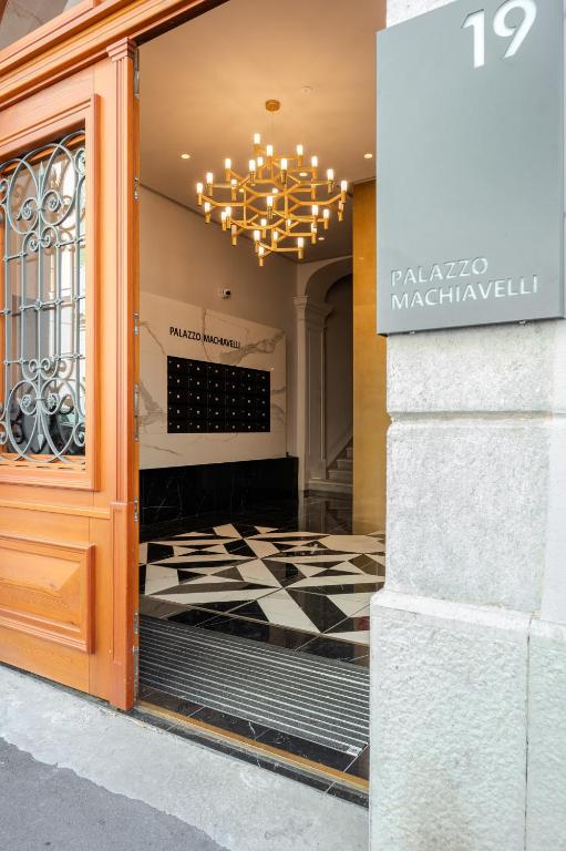 a store front with a window with a checkered floor at Palazzo Machiavelli Trieste in Trieste