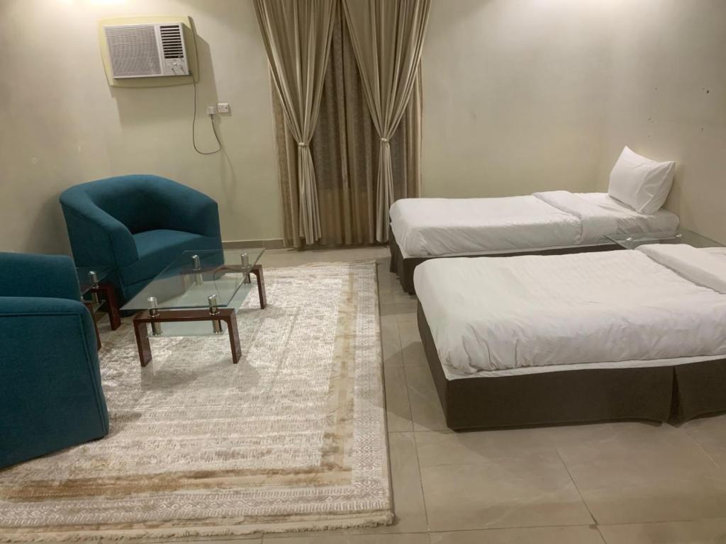 Postel nebo postele na pokoji v ubytování سرايا سين للشقق المخدومة