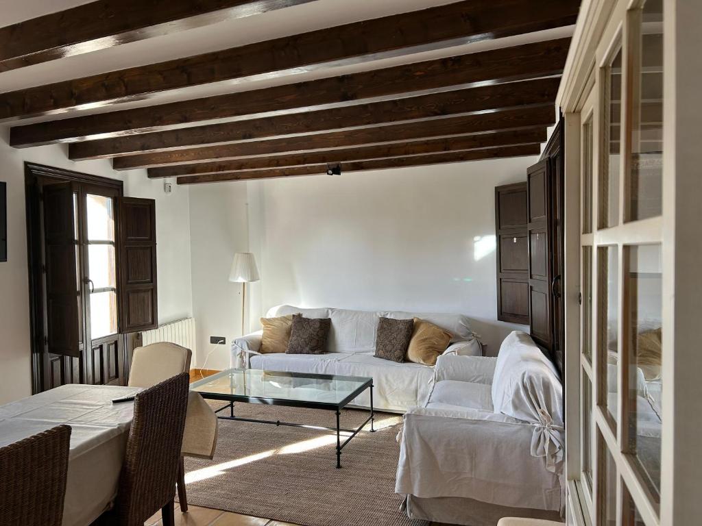 Ένα ή περισσότερα κρεβάτια σε δωμάτιο στο Casona Arquillo del Judío