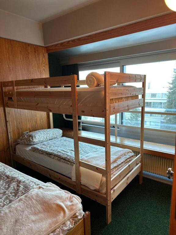 En eller flere senge i et værelse på La Dimora di Pace, adiacente alle piste per 7 persone