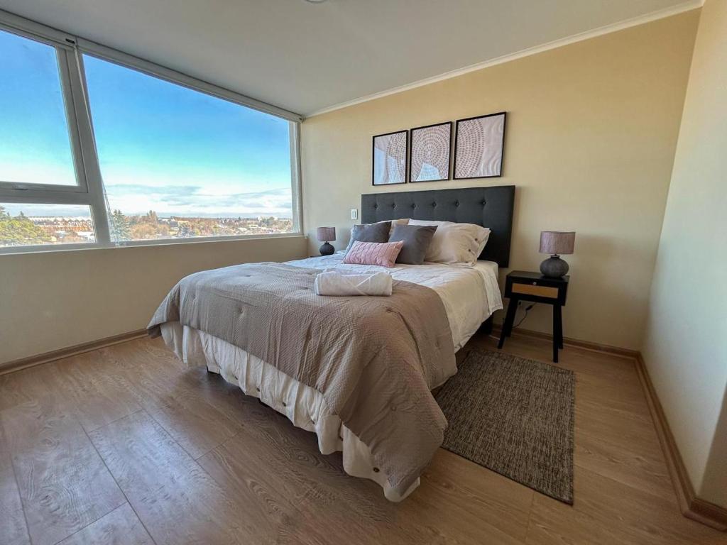 Ένα ή περισσότερα κρεβάτια σε δωμάτιο στο Dpto por dia Chillán 909