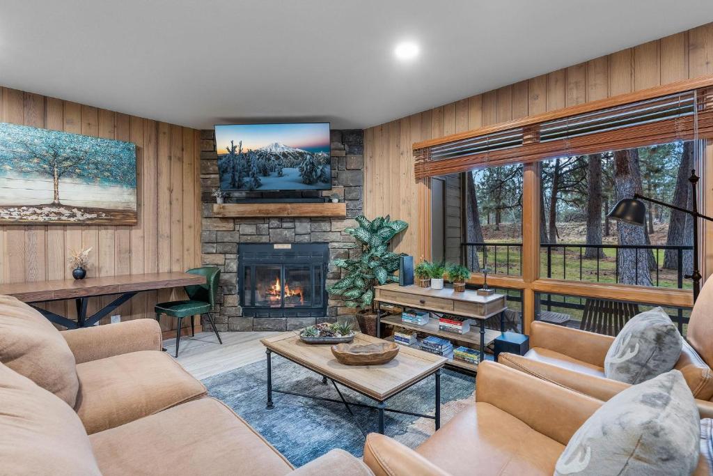 a living room with a couch and a fireplace at Bend Mt Bachelor Village Condo! in Bend