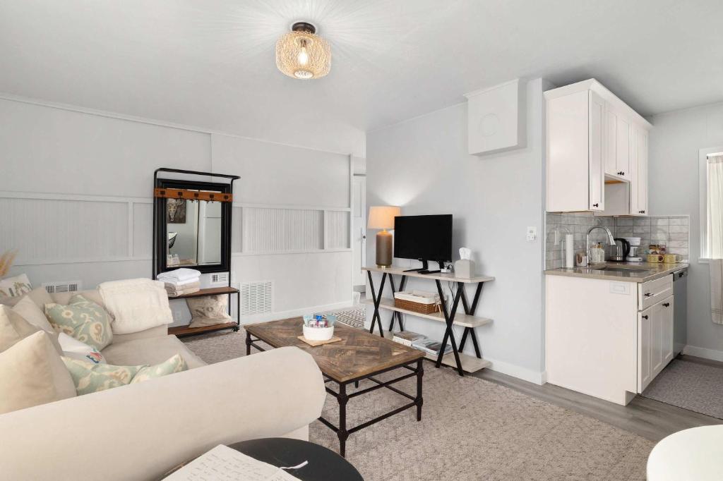 a living room with a couch and a table at Downtown location Near the Beach Dog Friendly in Edmonds