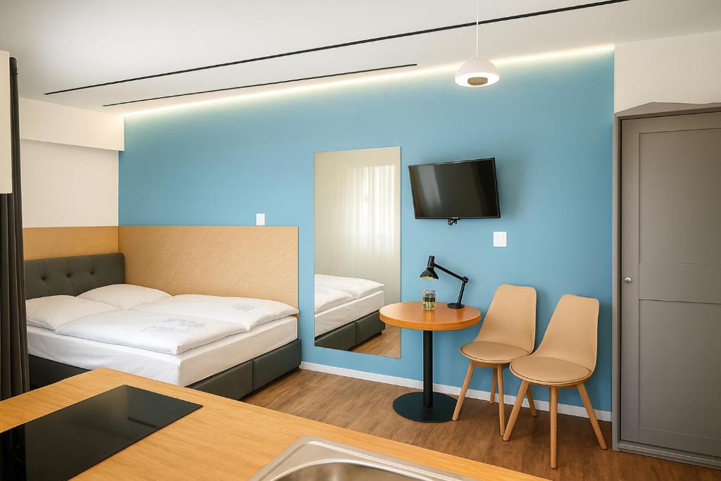 Ένα ή περισσότερα κρεβάτια σε δωμάτιο στο Modern Studio 7 private Kitchenette and Bathroom