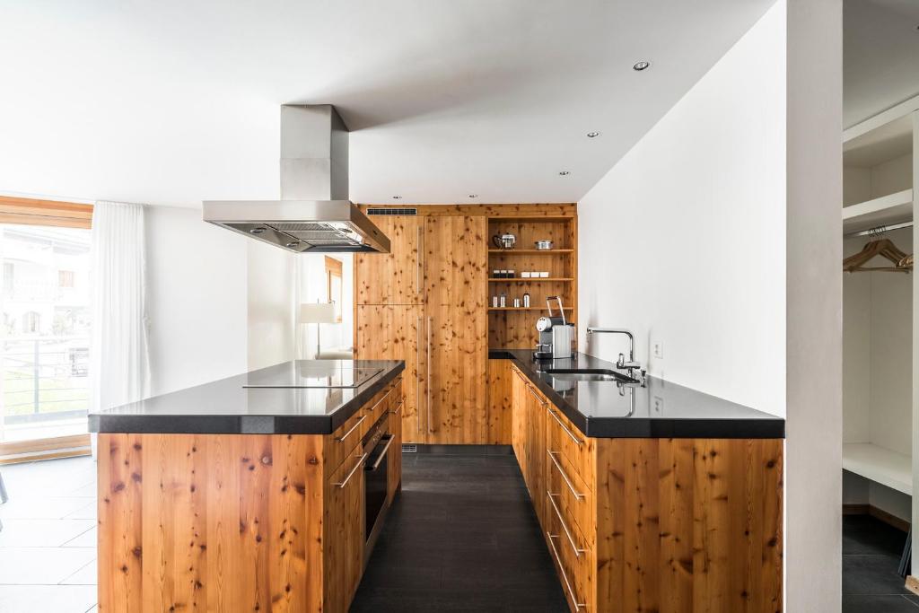 Kuchyň nebo kuchyňský kout v ubytování Ari Resort Apartments
