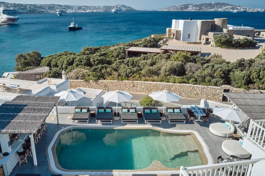 an image of a pool with a view of the ocean at Mykonos Princess Hotel in Agios Stefanos