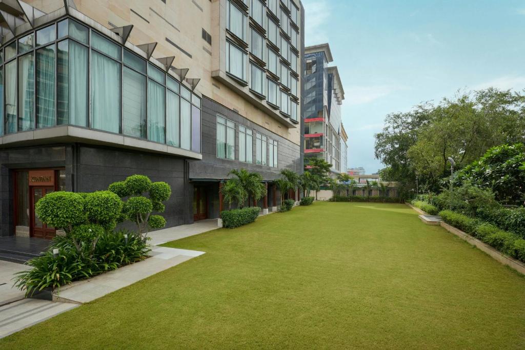 an empty lawn in front of a building at The Fern, Jaipur, Series by Marriott in Jaipur