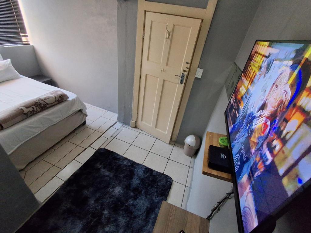 Postel nebo postele na pokoji v ubytování M J GuestHouse