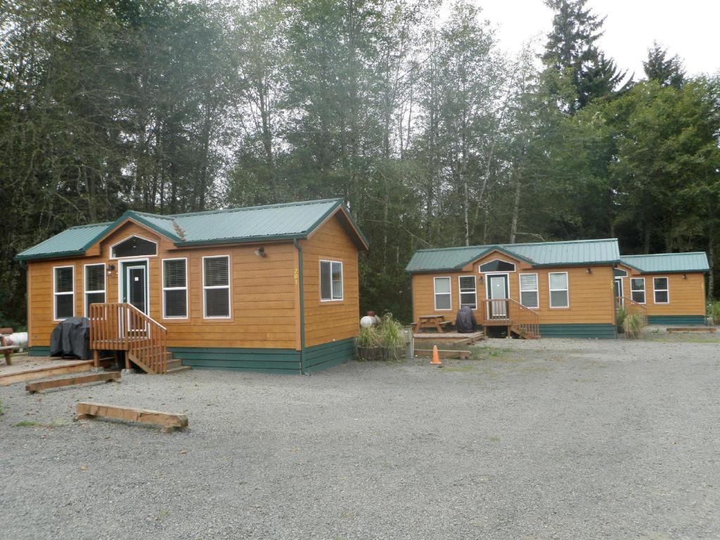a couple of tiny homes in a parking lot at Seaside Camping Resort Cottage 9 in Seaside