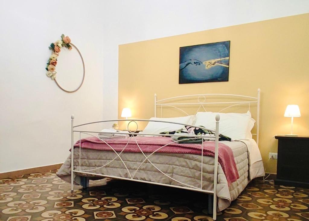a bedroom with a bed with a metal frame at Gasparro House in Turi