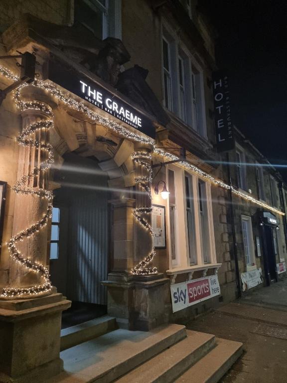 a building with a sign that reads the stanza at The Graeme Hotel in Falkirk