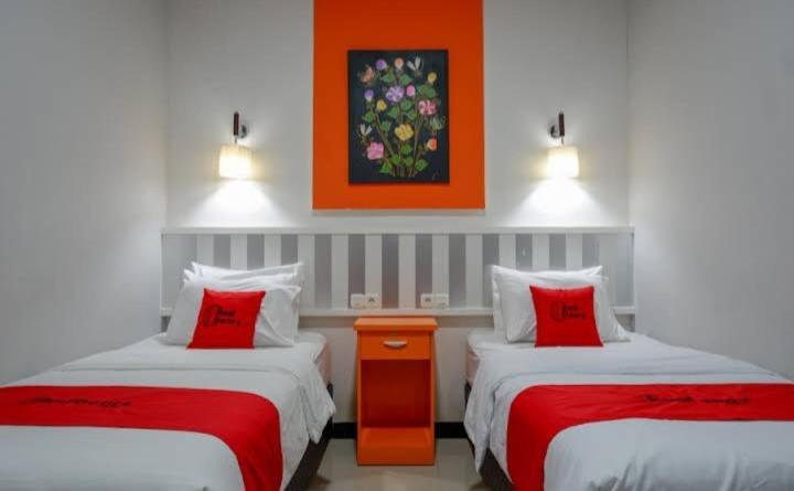 Postel nebo postele na pokoji v ubytování Hotel Grand illa palopo