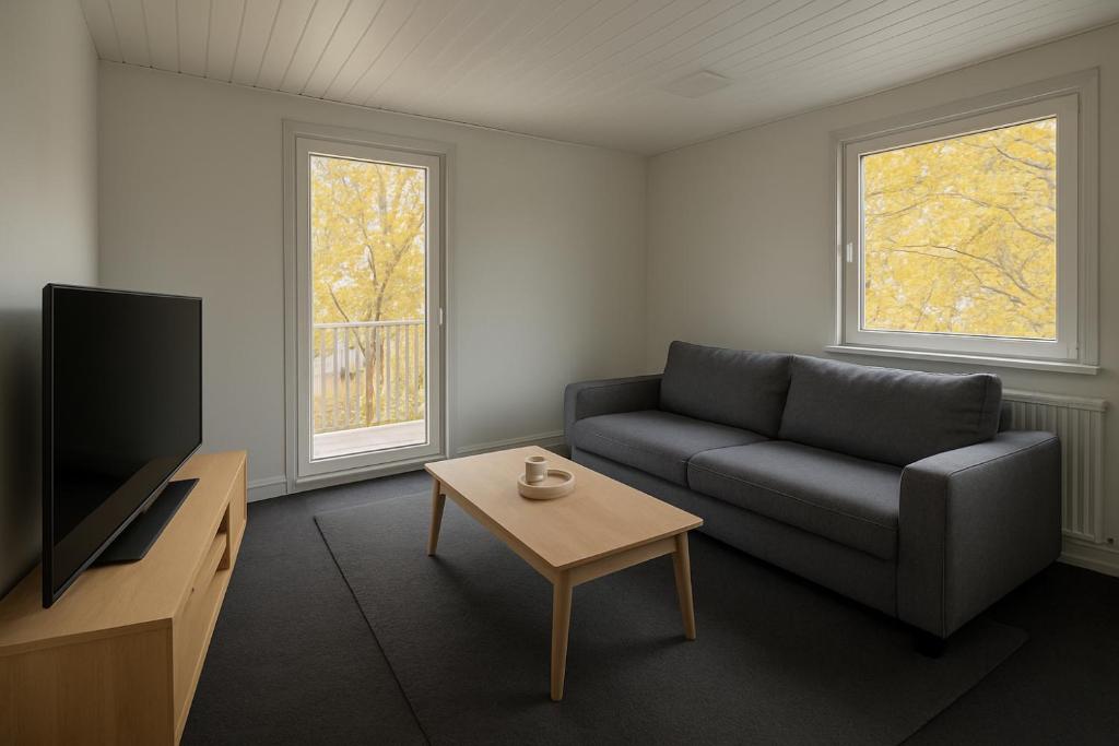 TV a/nebo společenská místnost v ubytování Polsumer Residence Moderne Unterkunft für Monteure & Familien nahe Veltins-Arena, Movie Park, Nordsternpark, Amphitheater & Autobahnen A2 & A42 mit Balkon