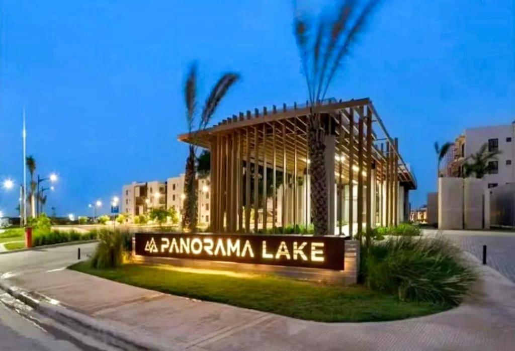 a building with a sign in front of it at Panorama Lake in Punta Cana