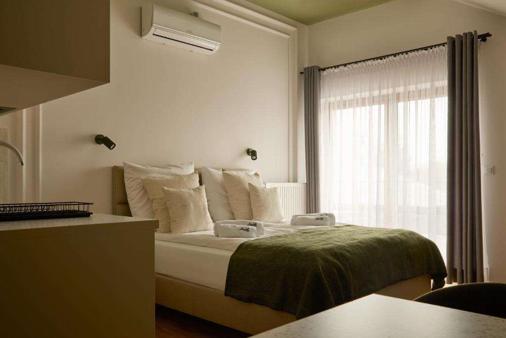 Кровать или кровати в номере Stodoła U Gajdy