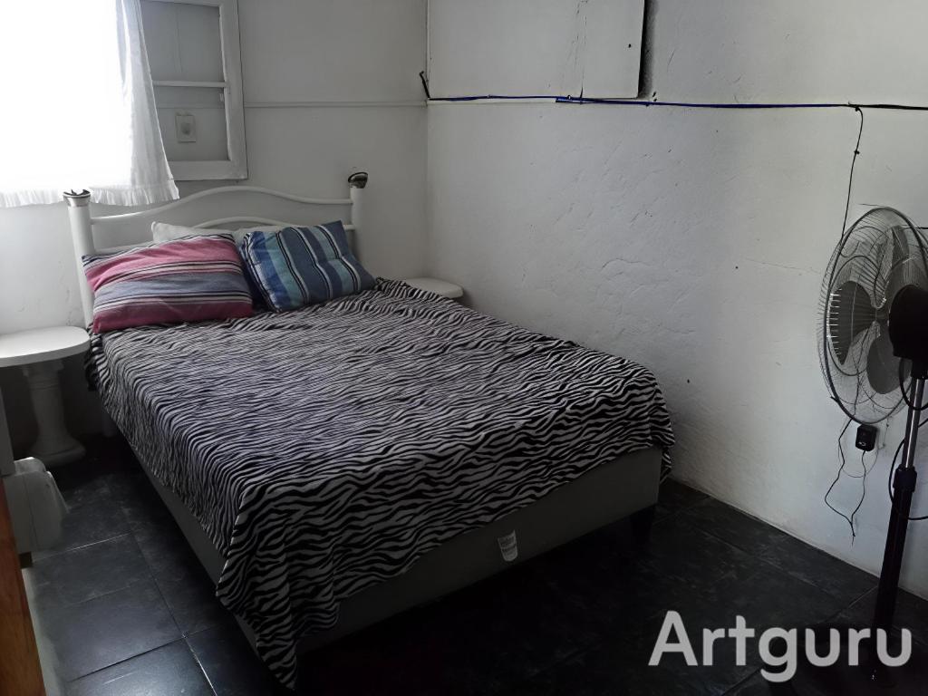 Postel nebo postele na pokoji v ubytování ALQUILO CASA FRENTE AL MAR PARQUE DEL PLATA CON BARBACOA PARa 8