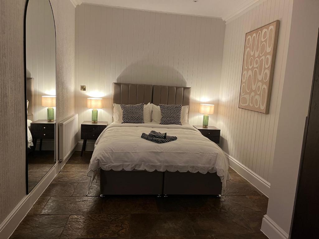 En eller flere senge i et værelse på The Croft Farmhouse Apartments