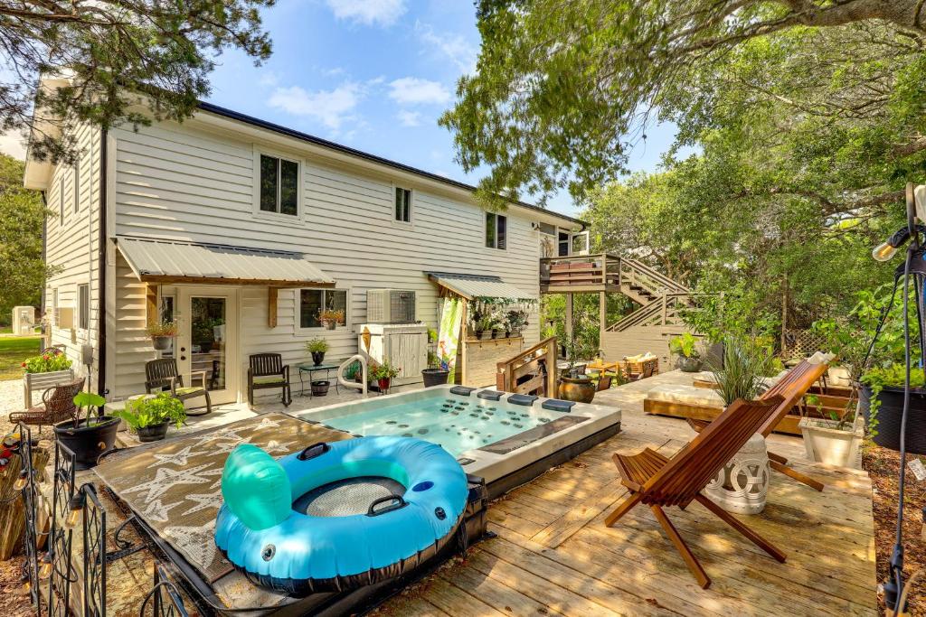 a backyard with a swimming pool and a house at Steps to Sand! Topsail Beach Group Getaway! in Surf City