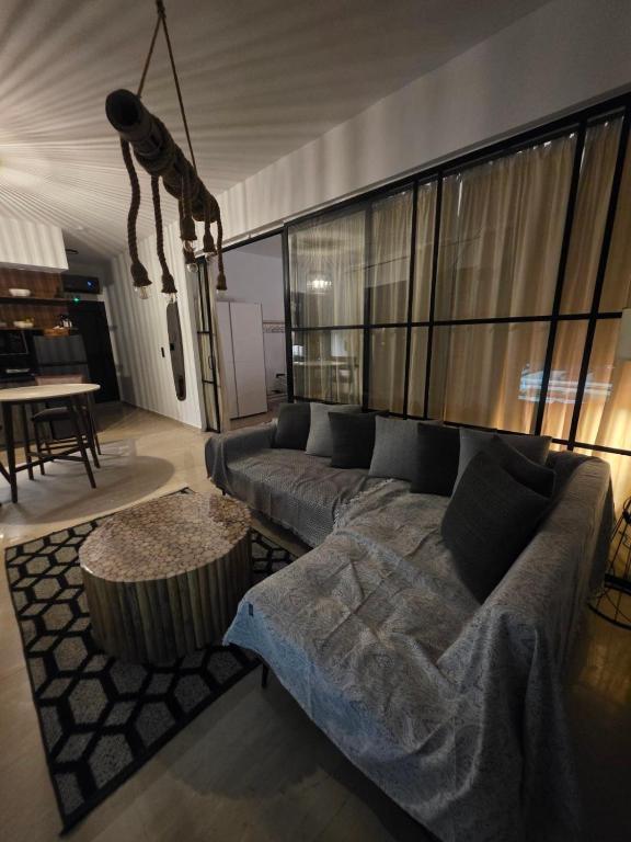 a living room with a couch and a table at Mimis Skyline in Xanthi