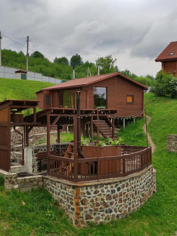 a house on top of a stone wall at Berdo Svaliava in Svalyava