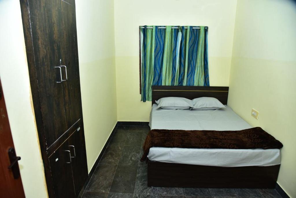 Ένα ή περισσότερα κρεβάτια σε δωμάτιο στο Anichethana
