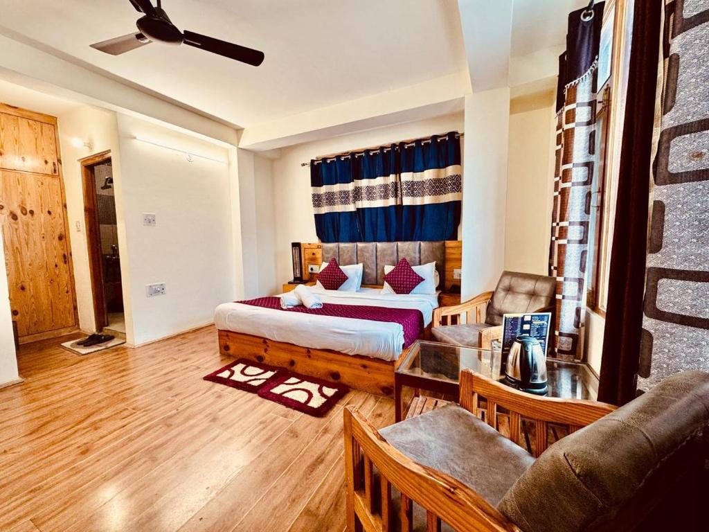 Ένα ή περισσότερα κρεβάτια σε δωμάτιο στο Royal Majestic Mount View Cottage