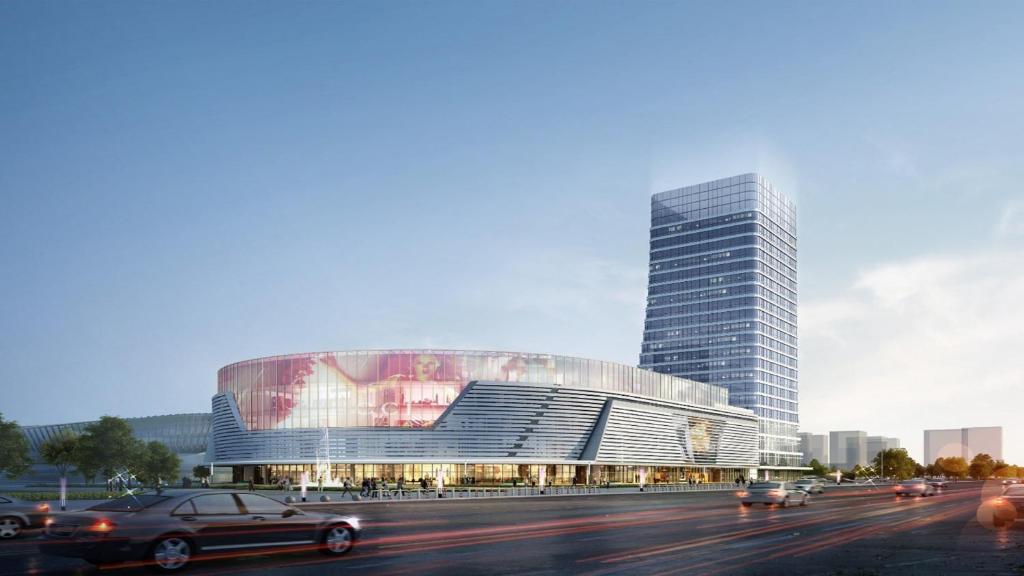 a rendering of a building with cars in front of it at Crowne Plaza Linyi Olympic Sports Centre by IHG in Linyi